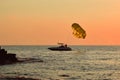 Silhouette of a parachute boat at sunset Royalty Free Stock Photo