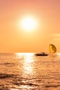 Silhouette of a parachute boat at sunset Royalty Free Stock Photo