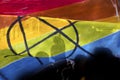 silhouette of a parade of gays and lesbians with a rainbow flag - symbol of love and tolerance