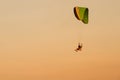 Silhouette Paramotor, Parachute, Paraglide flying in the sunset Royalty Free Stock Photo