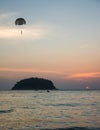 Silhouette of Parasailing at Kata beach with sunset background, extreme sports Royalty Free Stock Photo