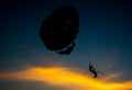 Silhouette of Parasailing at Kata beach with sunset background, extreme sports, Thailand Royalty Free Stock Photo