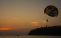 Silhouette of Parasailing at Kata beach with sunset background, extreme sports, Phuket, Thailand