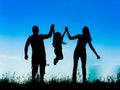 Silhouette of parents and kid having fun spending time