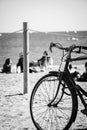 Silhouette of a parked bicycle on a beach