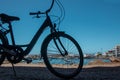 Silhouette of a part of a bicycle with a sea view