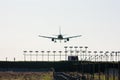 Silhouette of passenger aircraft on landing with approaching runway lights Royalty Free Stock Photo