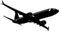 Silhouette of a passenger plane in the sky with retracted landing gear.