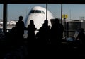 Silhouette of Passengers Waiting for Their Flight Royalty Free Stock Photo