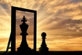 Silhouette of a pawn, sees himself in the reflection of the mirror queen Royalty Free Stock Photo