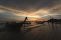 Silhouette of a people and boat by the beach Royalty Free Stock Photo