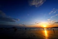 Silhouette of people and boat on the beach with sunset, blue sky and cloud at Aonang, Krabi, Thailand. Royalty Free Stock Photo