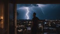 silhouette of people in the city He was watching the lightning and thunderstorm flash with raining background from his window,