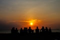 silhouette family sit and looking sunset on beach Royalty Free Stock Photo