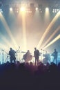 Silhouette People Group at Music Concert. Cheering Crowd at a Concert in Front of Bright Lights. Vintage Style, Happy People Royalty Free Stock Photo