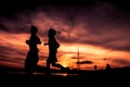 Silhouette of people jogging