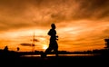 Silhouette of people jogging
