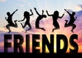 Silhouette people jumping over the word to friends Royalty Free Stock Photo