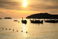 Silhouette people kayak by boats on sea at sunset, Ko Lipe island Royalty Free Stock Photo