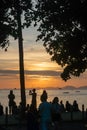 Silhouette of people looking at the sunset in the sea, in Ao Nang, Thailand