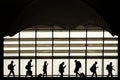 Silhouette of people looking on there phones during traveling. Just the backpacker without phone in different direction