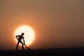 Silhouette people mining on sky sunset background.