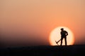 Silhouette people mining on sky sunset background.