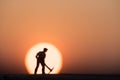 Silhouette people mining on sky sunset background.