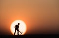 Silhouette people mining on sky sunset background.