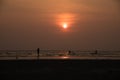 Silhouette people playing on beach