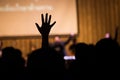 Silhouette people raising hands