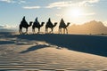 Silhouette people riding camels in desert native tuareg arabic african person Sahara wildlife tourist attraction Dubai Royalty Free Stock Photo