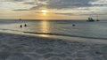 Silhouette of people in the sunset at beach in Aruba