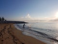 Silhouette people throw a fishing net into the sea Royalty Free Stock Photo