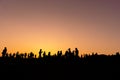 Silhouette People and tourists Doing activities and taking pictures of the sunset in the evening. Royalty Free Stock Photo