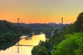 Silhouette of people traveling across bridge