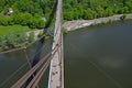 Silhouette of people traveling across bridge