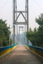 silhouette of people traveling across bridge