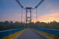 silhouette of people traveling across bridge