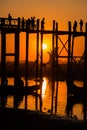 Silhouette of people on U Bein bridge at sunset in Amarapura. Mandalay, Myanmar Royalty Free Stock Photo