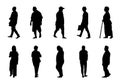 Silhouette people walking collection on white background, Black men and women vector Royalty Free Stock Photo