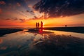 Silhouette of people walking at the sandy coast of the Baltic Sea at the scenic sunset in Lithuania Royalty Free Stock Photo