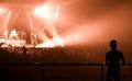 Silhouette of people, watching a band on stage Royalty Free Stock Photo