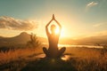 Silhouette of a person in yoga pose at mountain sunset Royalty Free Stock Photo