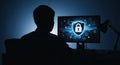 Silhouette of a person in front of a computer screen displaying a digital security shield with a padlock icon Royalty Free Stock Photo
