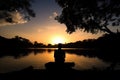 silhouette of a person meditating in nature serenity associated with yoga meditation Generative AI