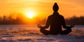 Silhouette of a person practicing yoga in a tranquil winter setting during sunrise for mindfulness Royalty Free Stock Photo