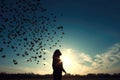 Silhouette Of Person Releasing Flock Of Butterflies Into The Sky, Symbolizing Environmental Conservation. Generative AI Royalty Free Stock Photo