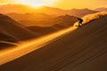 A silhouette of a person sandboarding at sunset, creating a trail of sand in the air Royalty Free Stock Photo