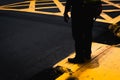 Silhouette person standing on a yellow ground